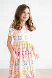 CHECKMATE SHORT SLEEVE POCKET TWIRL DRESS