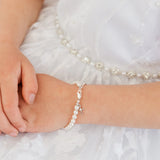 PEARLS CROSS BRACELET